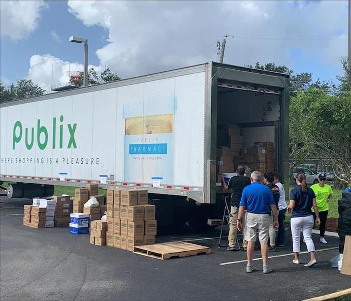 publix truck being loaded with boxes