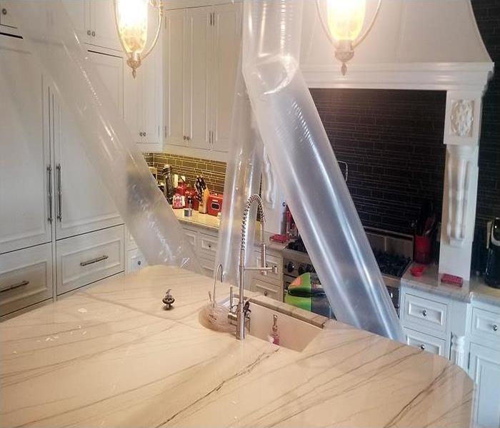 kitchen with plastic tubes directing forced air