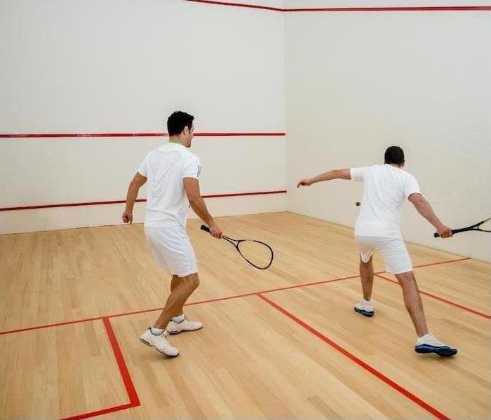RACKETBALL COURT AFTER WATER DAMAGE, TWO PLAYERS